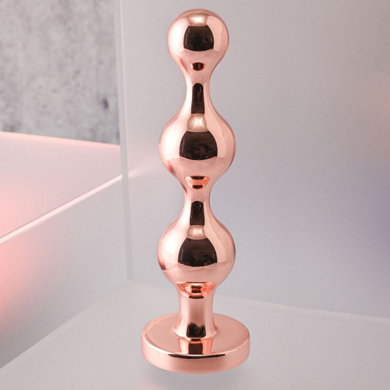 Gender X GOLD DIGGER Large - Rose Gold Large Butt Plug with Black Gem Base Gender X