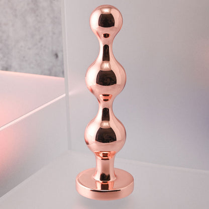 Gender X GOLD DIGGER Large - Rose Gold Large Butt Plug with Black Gem Base Gender X
