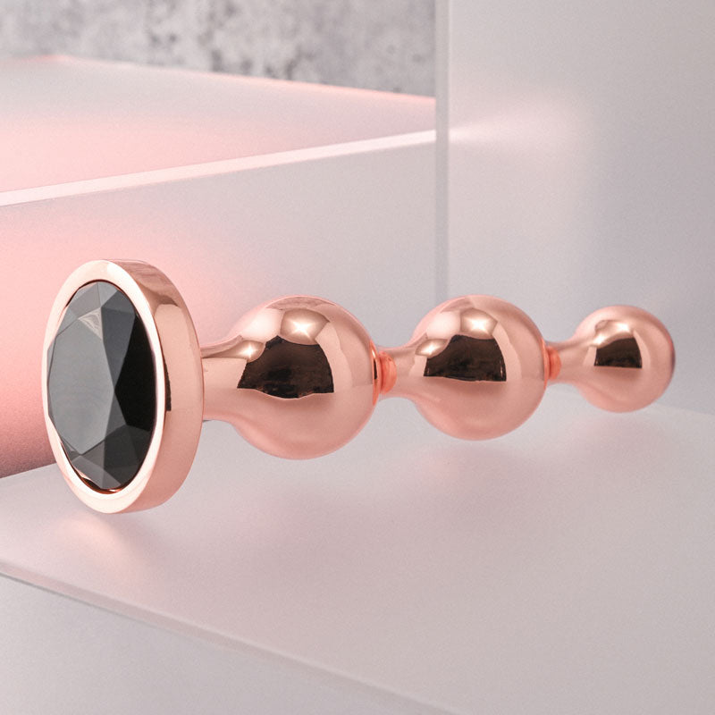 Gender X GOLD DIGGER Large - Rose Gold Large Butt Plug with Black Gem Base Gender X