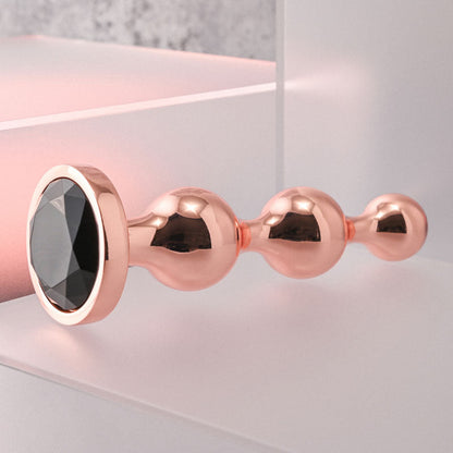 Gender X GOLD DIGGER Large - Rose Gold Large Butt Plug with Black Gem Base Gender X