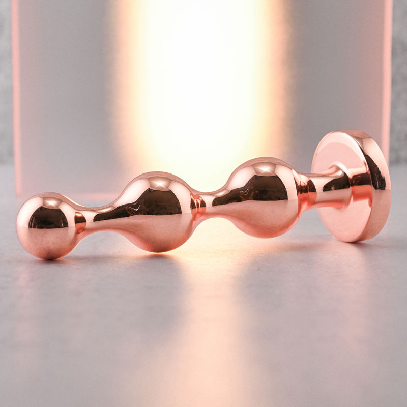 Gender X GOLD DIGGER Large - Rose Gold Large Butt Plug with Black Gem Base Gender X