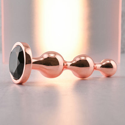 Gender X GOLD DIGGER Large - Rose Gold Large Butt Plug with Black Gem Base Gender X