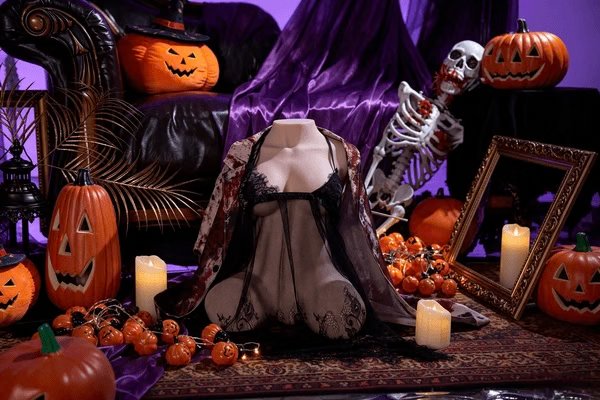 Tantaly torso doll in black lace and a sheer robe beside a skeleton